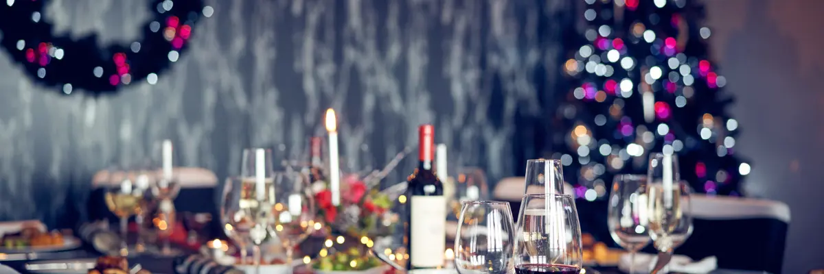 Table with Christmas dinner arranged for multiple people
