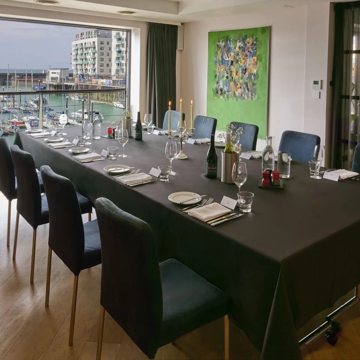 Dining room featuring a table and chairs with round glass ceiling lighting fixtures and a feature window 